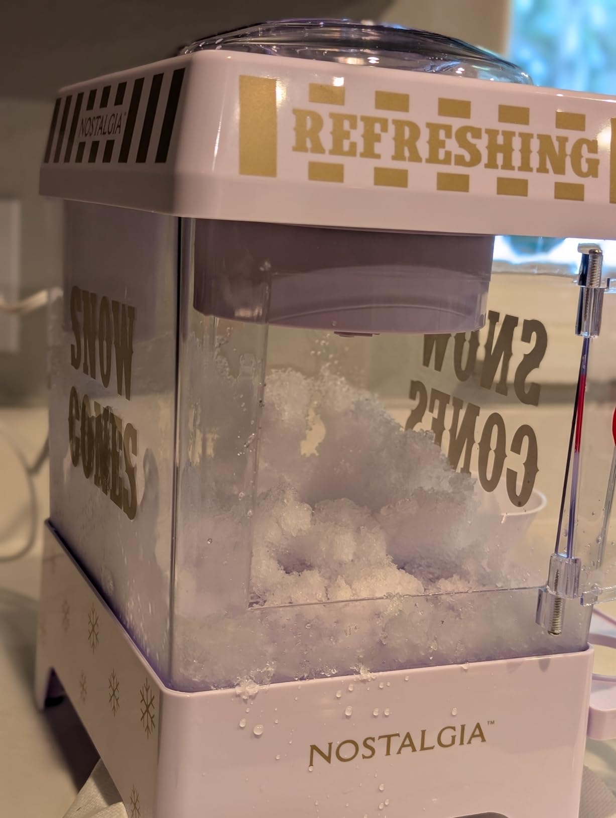Nostalgia Snow Cone Shaved Ice Machine - Retro Table-Top Slushie Machine Makes 20 Icy Treats - Includes 2 Reusable Plastic Cups & Ice Scoop - White customer photo 2