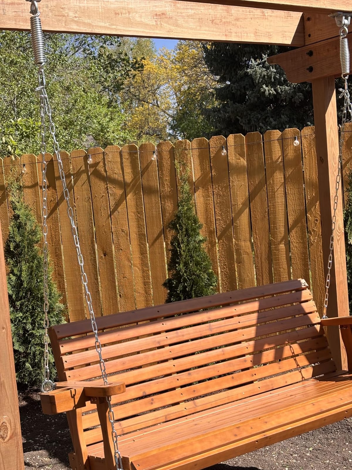Wooden Porch Swing 2-Seater, High Backrest and Deep Seat, Bench Swing with Cupholders, Hanging Chains and 7mm Springs, Heavy Duty 880 LBS, for Outdoor Patio Garden (Cedar Tone - 4 FT Extra Large) customer photo 2