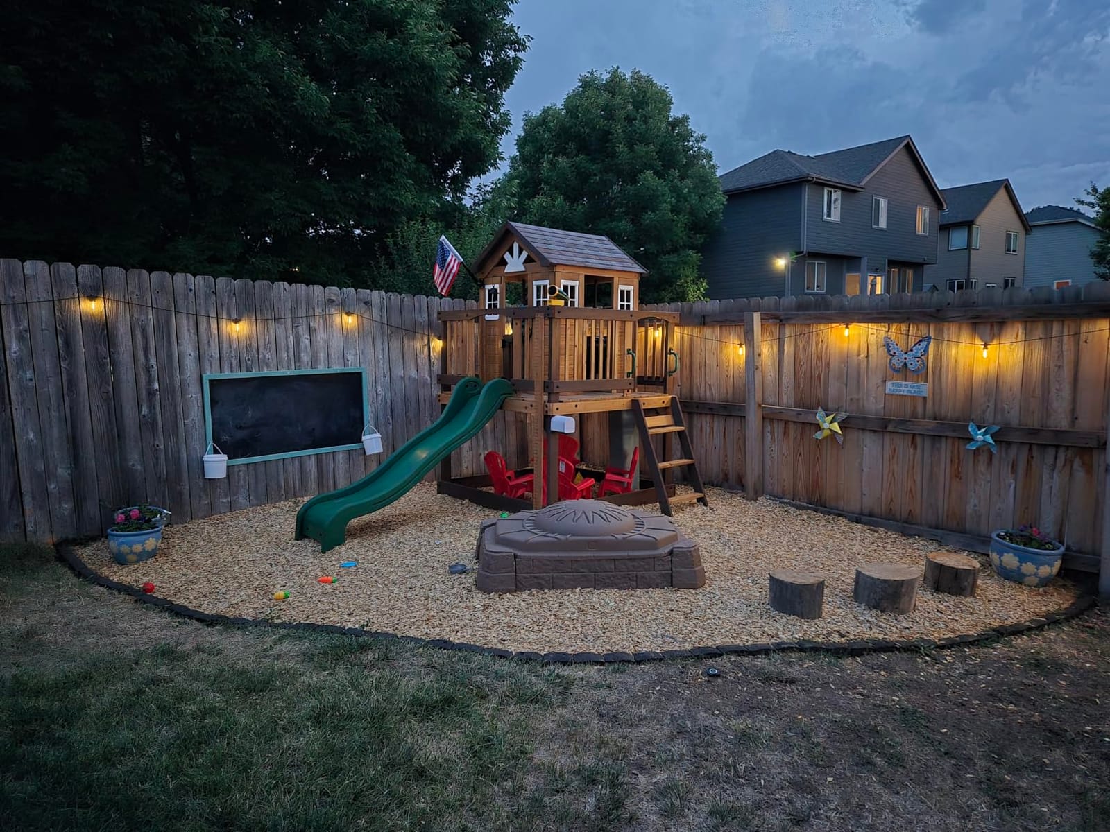 Backyard Discovery Beacon Heights Elevated Cedar Wooden Kids Playhouse with Wave Slide, Play Kitchen, Wrap-Around Deck, Flat-Step Ladder, Half Door, Windows, Bell, and Growth Chart for Outdoor Play customer photo 2