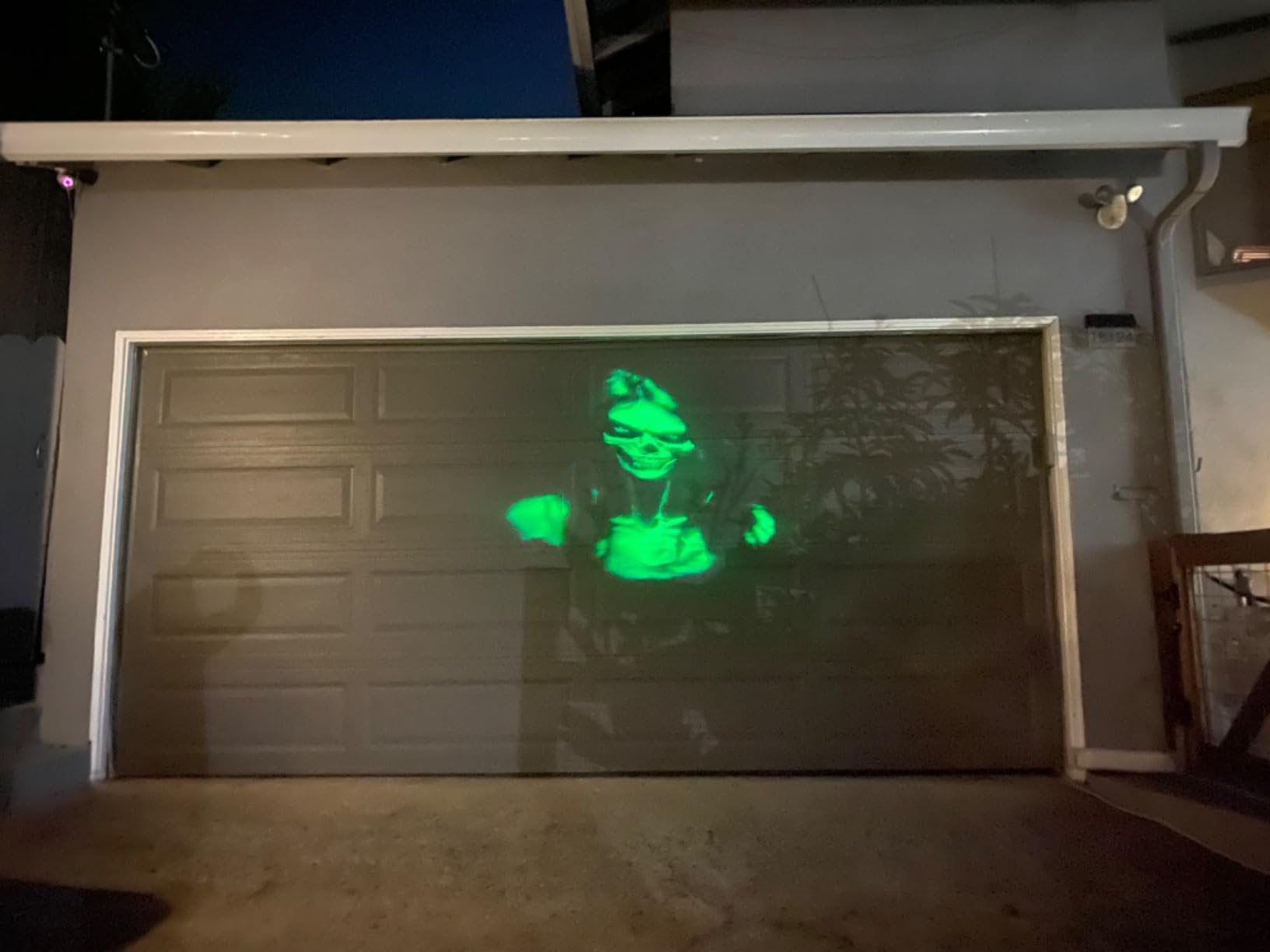 Halloween Projector Outdoor, 2026 Upgraded 3D Dynamic Skull HD Patterns,Clearer Holiday Light Ideal for Window Wall Displays and Halloween Garage Door Cover Projections customer photo 2